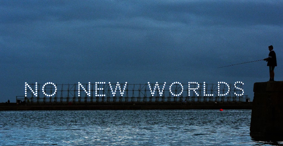 Illuminated art work standing on Mount Batten pier that spells out 'No New Worlds'